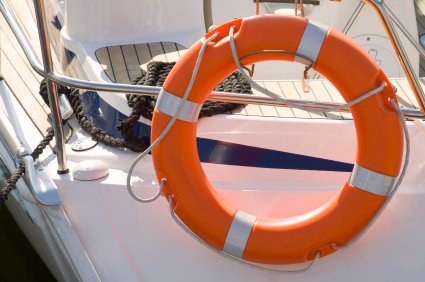 Orange Lifebuoy securely mounted on safety rail  