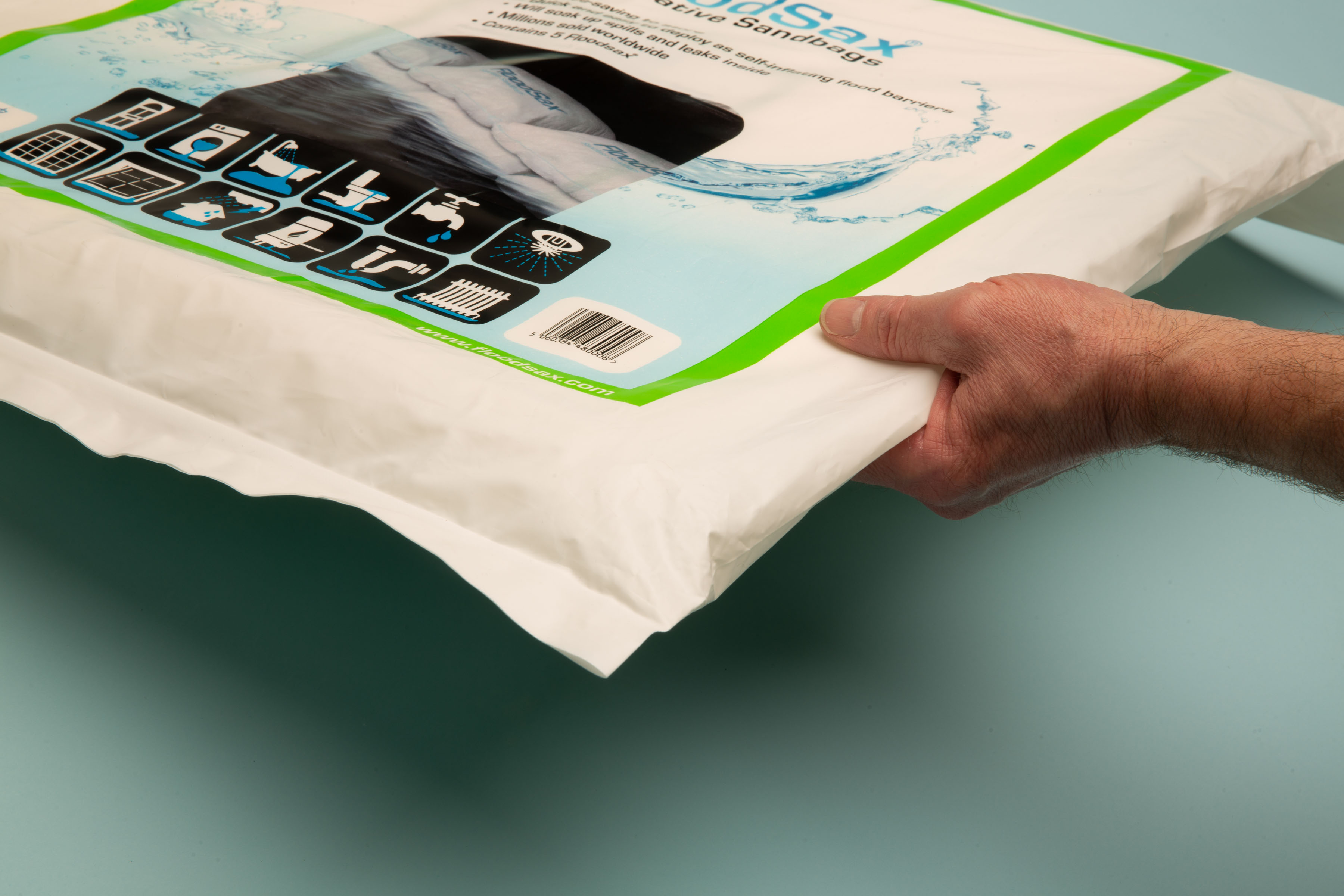 Close-up, high-resolution image of FloodSax packaging, showcasing clear branding and illustrative flood defense applications.